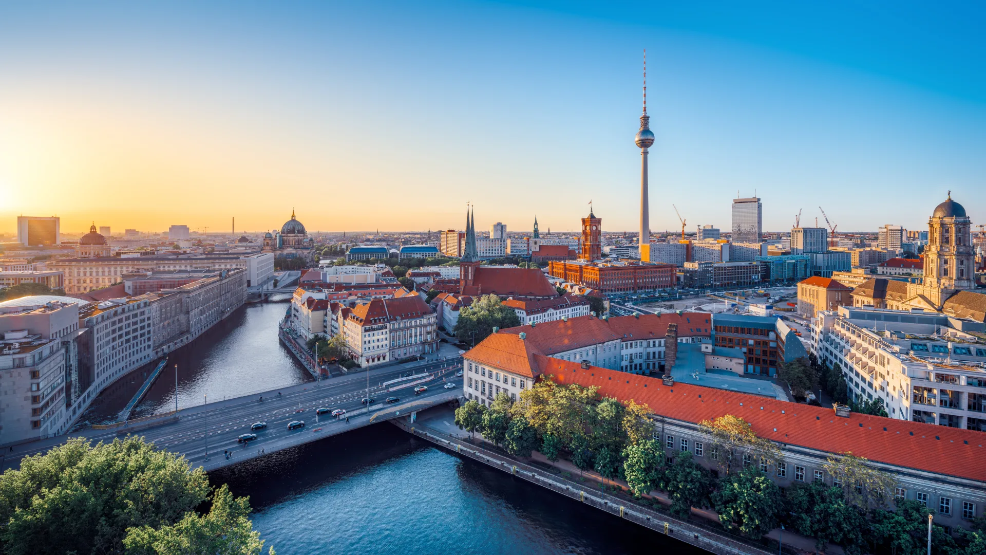 The Berlin skyline at sunset, with the Fernsehturm television tower and the river Spree, Germany